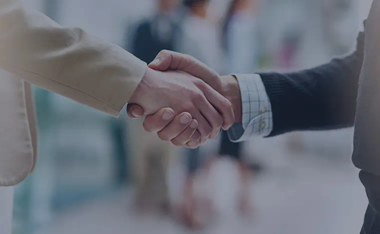 Code of Ethics Two business men shaking hands.